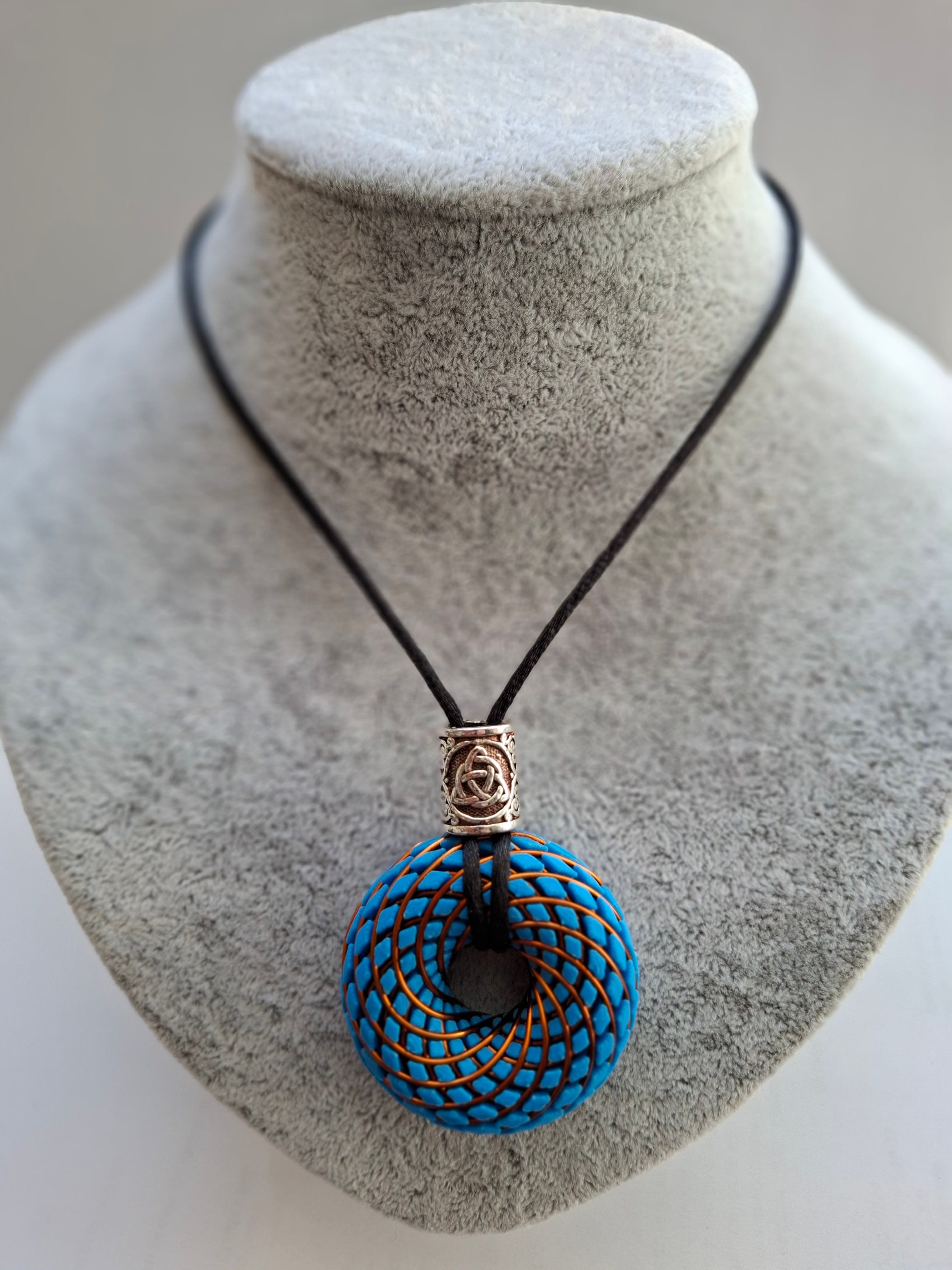 PlasmaThor Rodin Coils Anhänger — Cyan